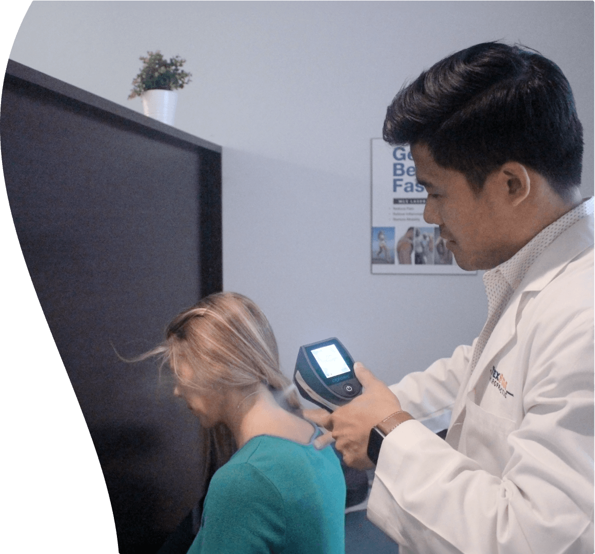 Dr Tran using a spot cryotherapy gun on a clients neck