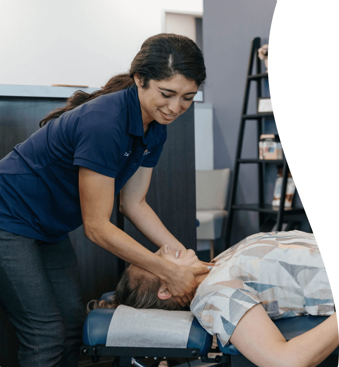 Dr Zavala helping a woman with headache pain