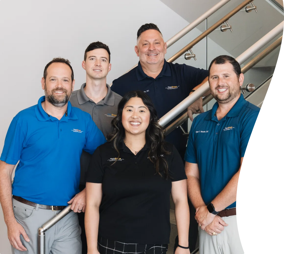 TexStar team of doctors standing on stairs for a team photo