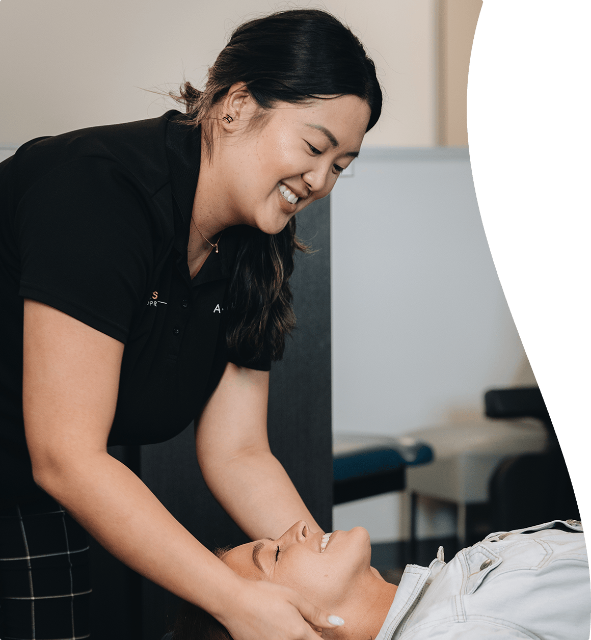 Dr Zavala helping a woman with headache pain