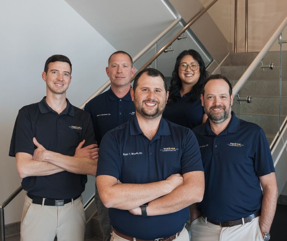 TexStar team of doctors standing on stairs for a team photo